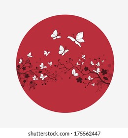 Cherry blossom branch with butterfly on the red sun.