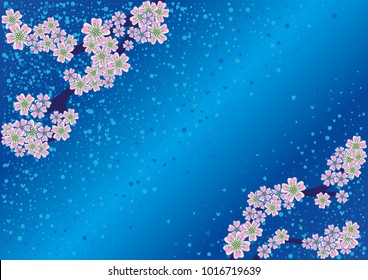 Cherry blossom branch with falling petals on a blue background