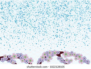 Cherry blossom branch with falling petals on a japanese background