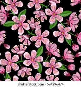 Cherry blossom embroidery seamless pattern. Needlework textile wallpaper isolated on black background