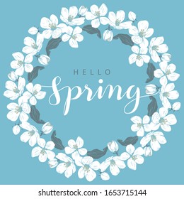Cherry blossom round frame with hello Spring lettering on a blue background