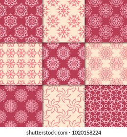 Cherry red and beige floral ornaments. Collection of seamless patterns for paper, textile