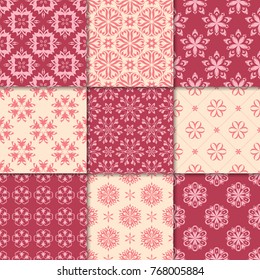 Cherry red and beige floral ornaments. Collection of seamless patterns for paper, textile