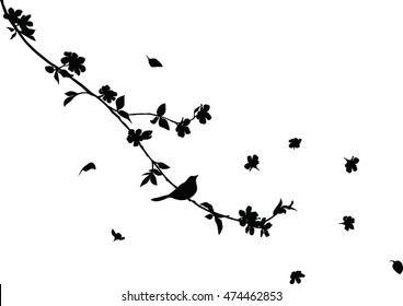 cherry tree branch with flying flowers and a blackbird