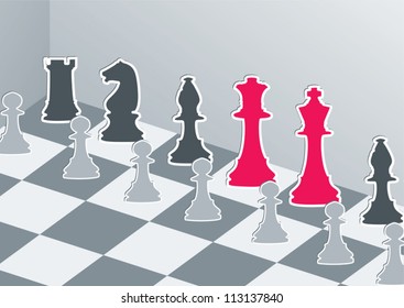Chess figures in gray with red king and queen