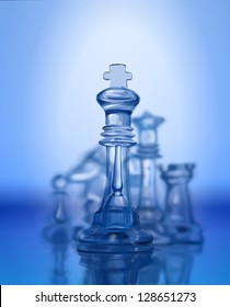 Chess figures, led by King on a blue background. Vector drawing / Eps10