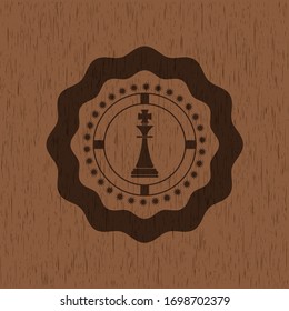 icono del ajedrez rey en el interior con fondo de madera