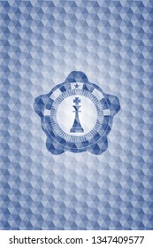chess king icon inside blue emblem or badge with abstract geometric polygonal pattern background.