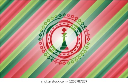 chess king icon inside christmas colors badge.