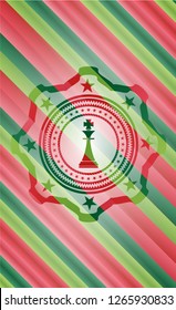 chess king icon inside christmas style badge..