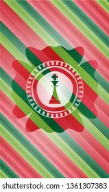chess king icon inside christmas emblem background.