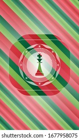 chess king icon inside christmas colors emblem.