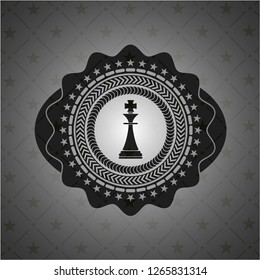 chess king icon inside dark emblem