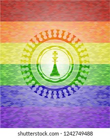 chess king icon inside emblem on mosaic background with the colors of the LGBT flag