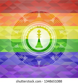 chess king icon inside emblem on mosaic background with the colors of the LGBT flag