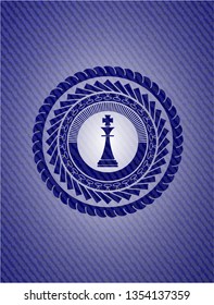 chess king icon inside emblem with denim high quality background