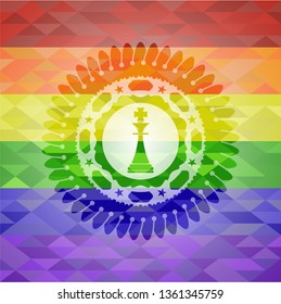 chess king icon inside emblem on mosaic background with the colors of the LGBT flag