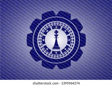 chess king icon inside emblem with jean texture