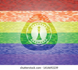 chess king icon inside emblem on mosaic background with the colors of the LGBT flag