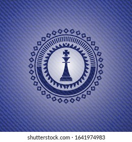 chess king icon inside emblem with jean texture