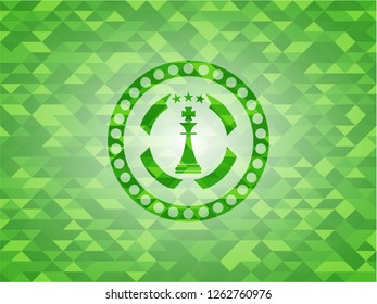 chess king icon inside green emblem with mosaic ecological style background