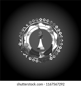 chess king icon inside grey camouflage emblem