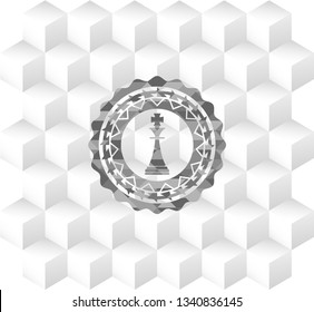 chess king icon inside grey badge with geometric cube white background