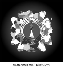 chess king icon inside grey camouflaged emblem