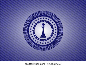 chess king icon inside jean or denim emblem or badge background