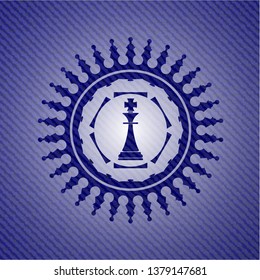 chess king icon inside jean or denim emblem or badge background