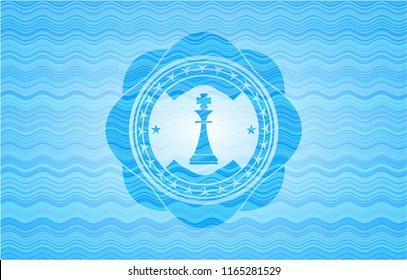 chess king icon inside light blue water wave style emblem.