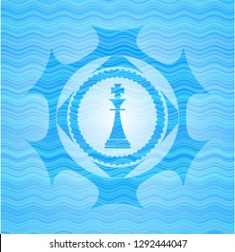 chess king icon inside light blue water wave badge background.