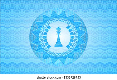 chess king icon inside light blue water style badge.