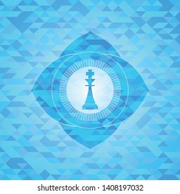 chess king icon inside light blue emblem with mosaic ecological style background
