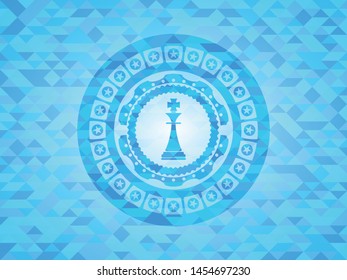 chess king icon inside realistic light blue mosaic emblem
