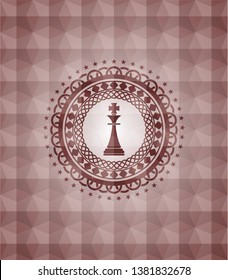 chess king icon inside red seamless geometric badge.
