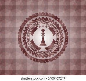 chess king icon inside red seamless geometric badge.