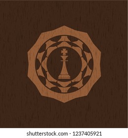 chess king icon inside retro wooden emblem