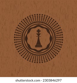 chess king icon inside retro wooden emblem. 