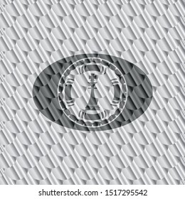 chess king icon inside shiny silver badge. Scales pattern. Vector Illustration. Detailed.