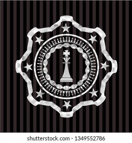chess king icon inside silver badge