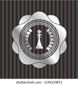 chess king icon inside silvery emblem or badge