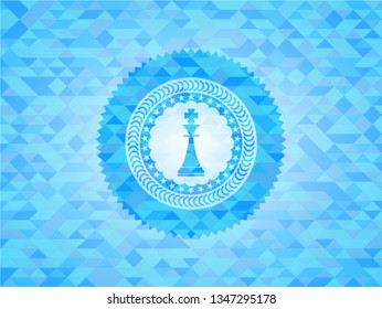 chess king icon inside sky blue emblem with mosaic background