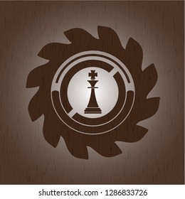 chess king icon inside vintage wood emblem