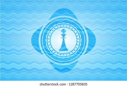 chess king icon inside water concept style emblem.