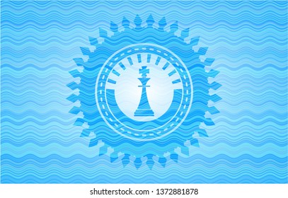 chess king icon inside water wave representation emblem background.