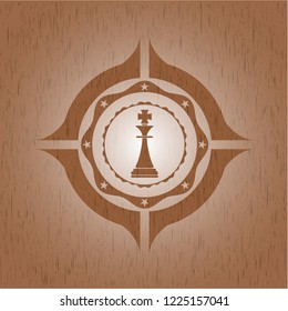 chess king icon inside wood badge or emblem