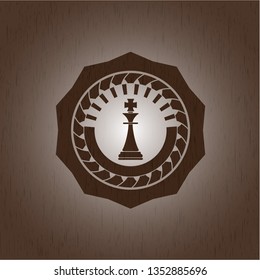 chess king icon inside wood emblem