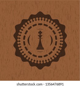 chess king icon inside wood badge or emblem