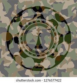 chess king icon on camo texture